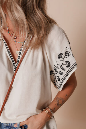 PREORDER: The Ava White & Black Embroidered Sleeves Top 2.24.25 osym